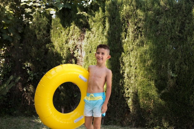 Child having fun with floater by the pool