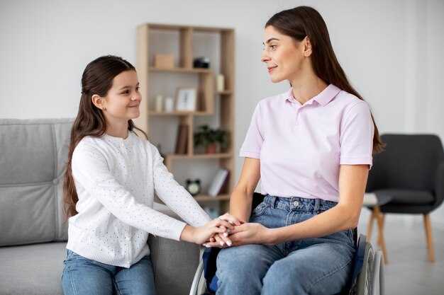 Child helping her disabled mother