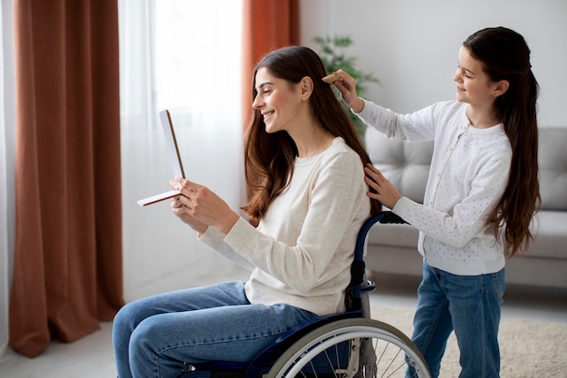 Free photo child helping her disabled mother