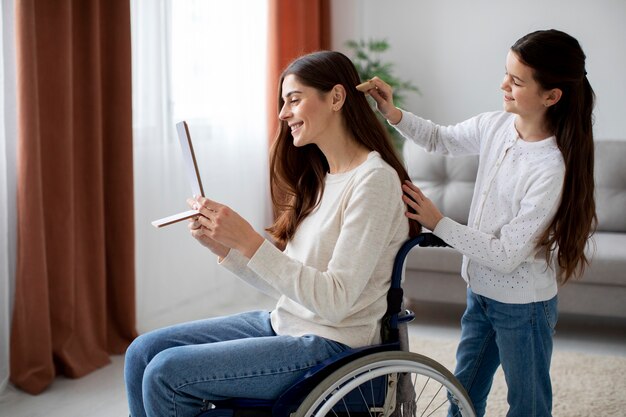 Child helping her disabled mother