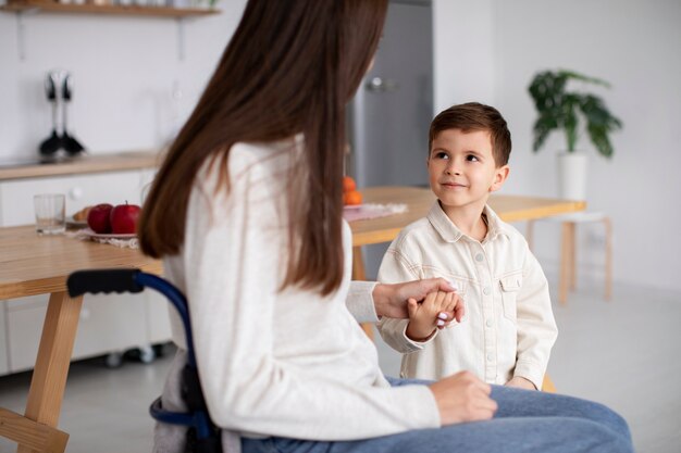 Child helping his disabled mother