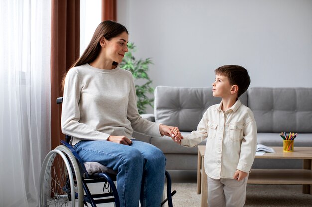 Child helping his disabled mother