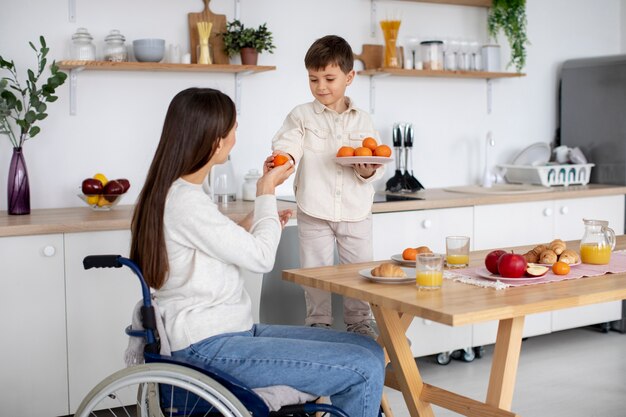 Child helping his disabled mother