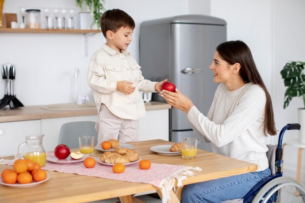 Child helping his disabled mother