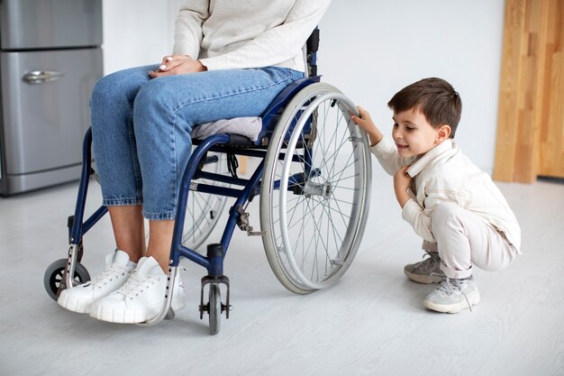 Child helping his disabled mother