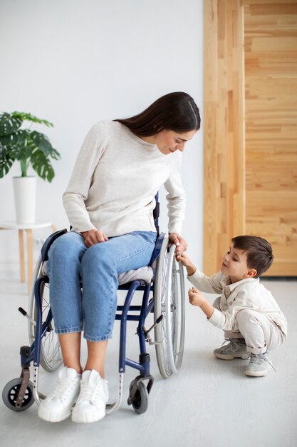 Child helping his disabled mother