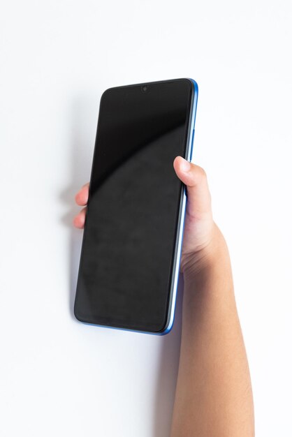 Child holding cellphone over white background