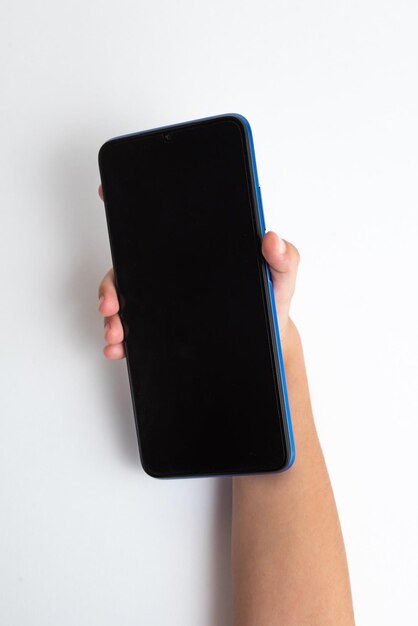 Child holding cellphone over white background