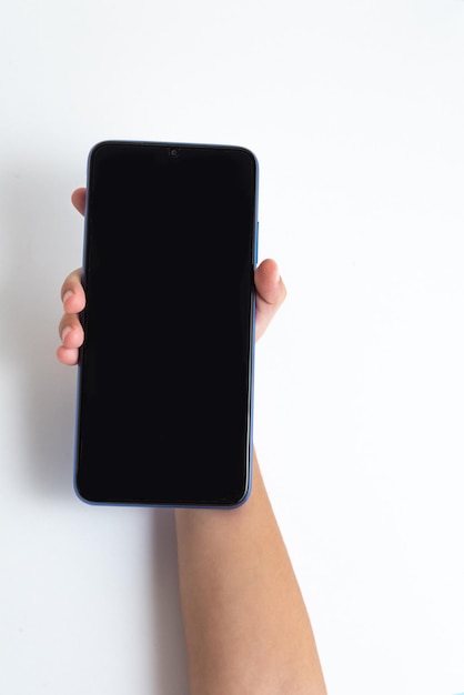 Child holding cellphone over white background