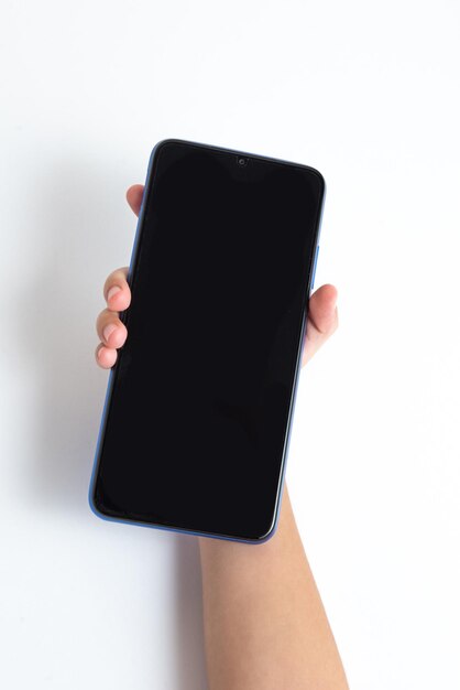 Child holding cellphone over white background