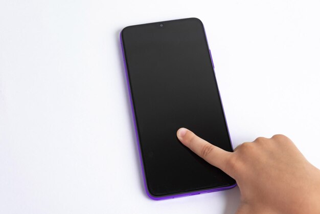 Child holding cellphone over white background