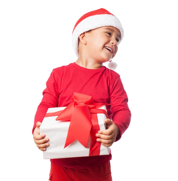 Child holding a white gift