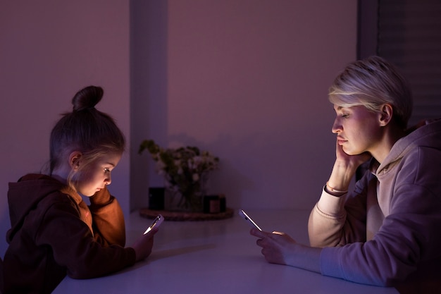 Child and parent suffering from social media addiction