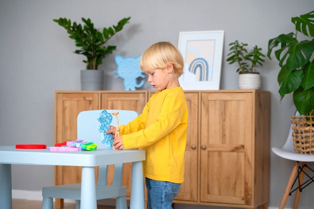 Free photo child playing with fidget at home