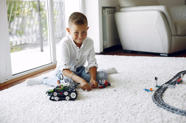 Free photo child playing with lego in a playing room