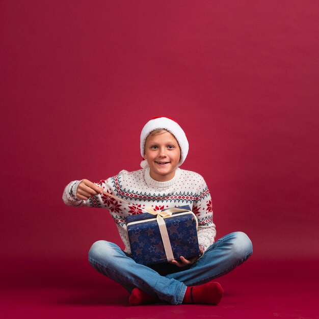 Child pointing at present front view