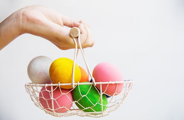 Child showing colorful Easter eggs happily - Easter holiday celebration concept