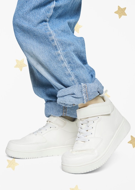 Child wearing jeans white sneakers