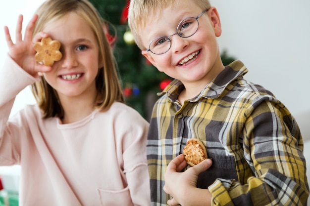 Free photo child with a cookie in the eye