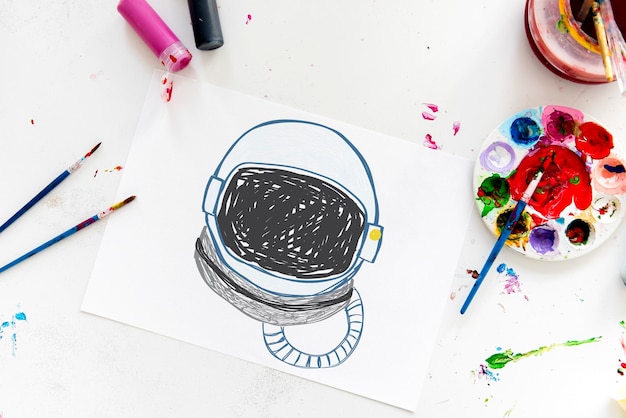 Child with a drawing of astronaut helmet