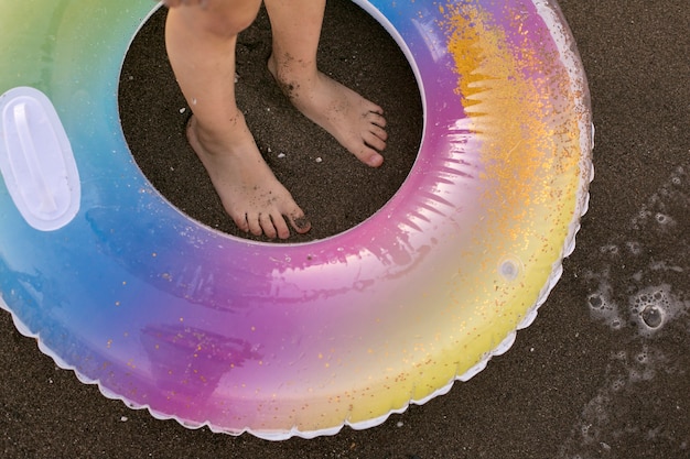 Child with floater by the seaside