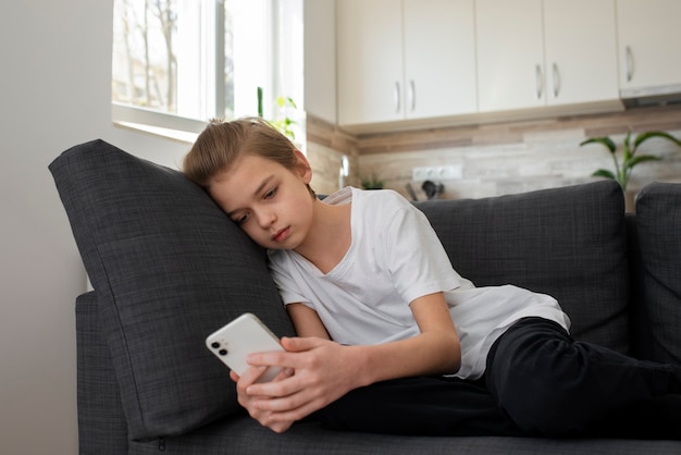 Free photo child with social media addiction