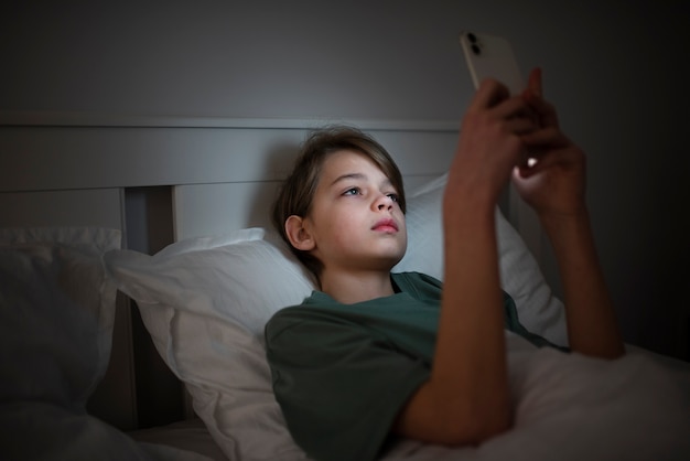 Free photo child with social media addiction