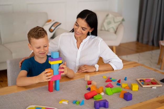 Child with their mom playing a  brain teaser