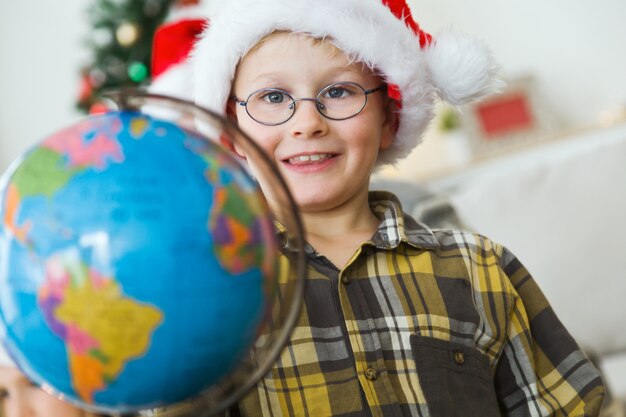 Child with a world globe