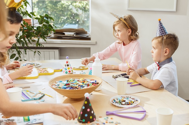 The children and birthday decorations.