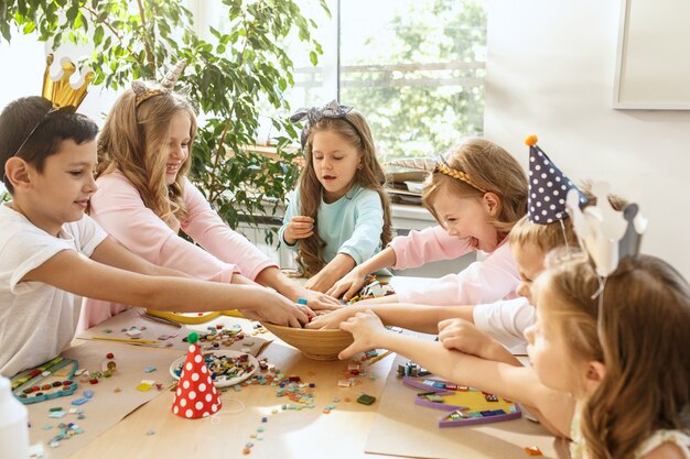 The children and birthday decorations.