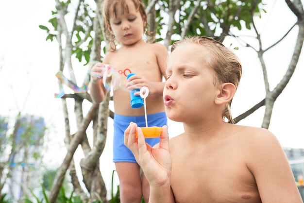 Children blowing soap bubbles