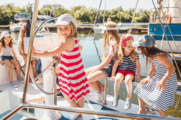 Free photo the children on board of sea yacht