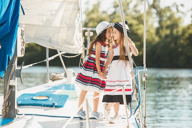 The children on board of sea yacht