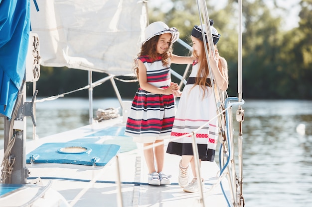 The children on board of sea yacht.