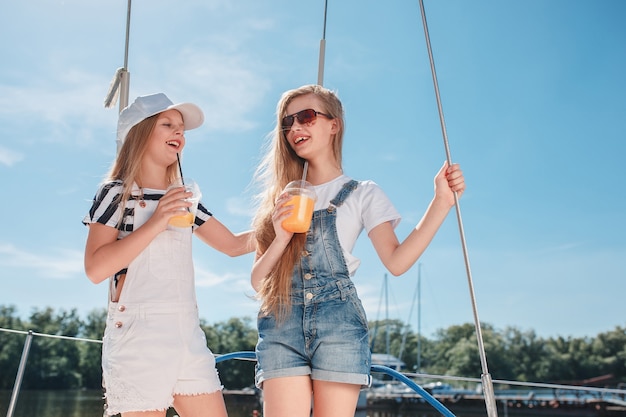 The children on board of sea yacht