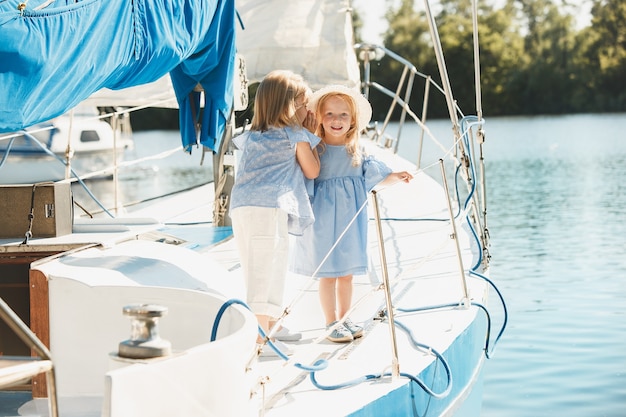 The children on board of sea yacht