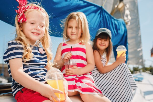 The children on board of sea yacht