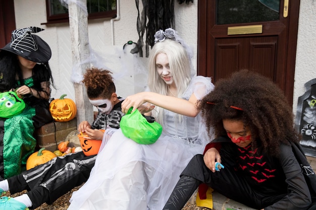 Children in costumes eating their candies