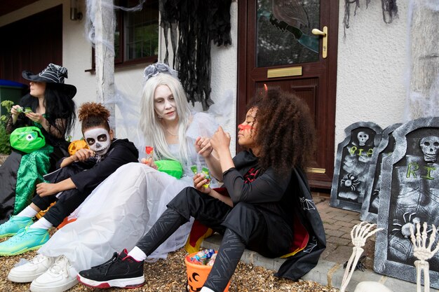 Children in costumes eating their candies