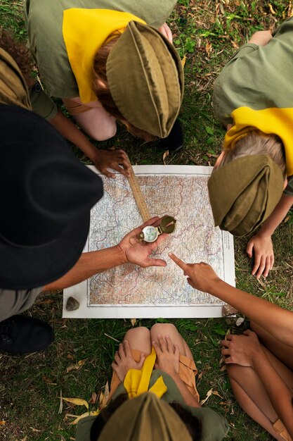 Children doing scout activities outdoors