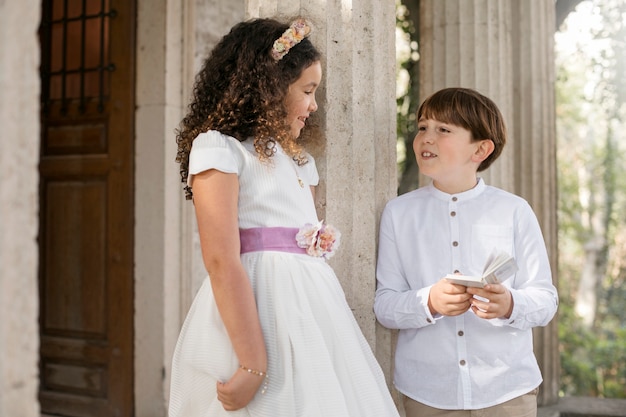 Free photo children getting ready for their first communion