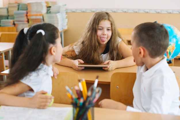 Children grimacing in class