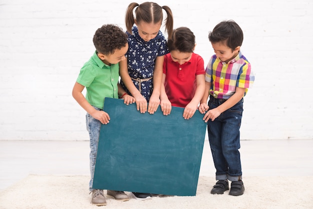 Children group with a blackboard