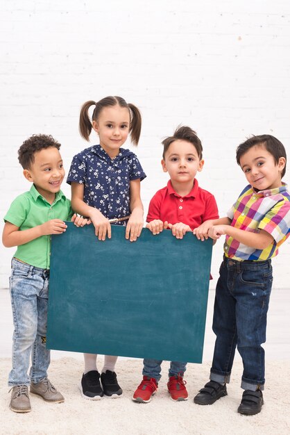 Children group with a blackboard