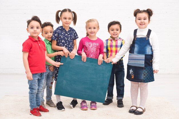 children group with a blackboard