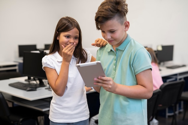 Children having technology education class