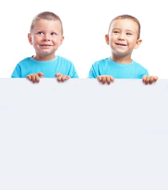 Children holding a blank banner