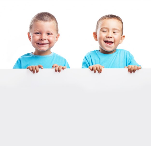 Children holding a blank banner