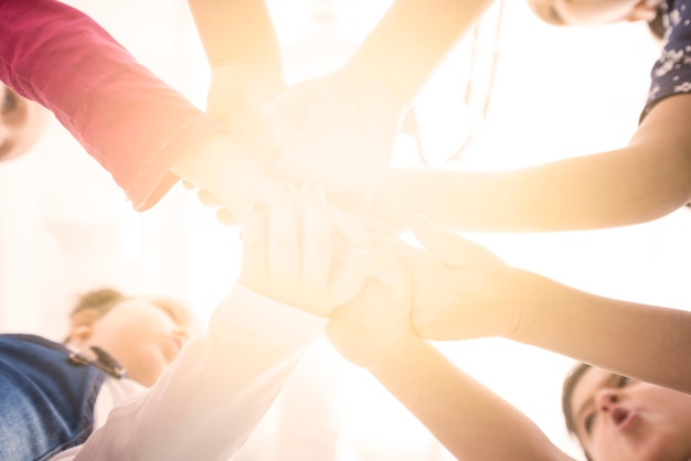 Children holding hand in group